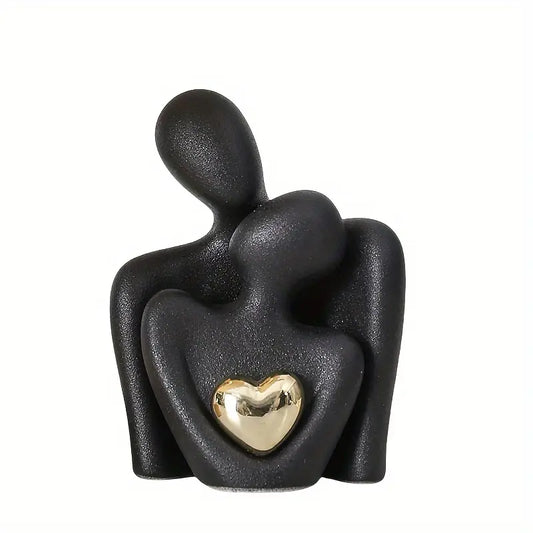 Modern ceramic statuette with a golden heart