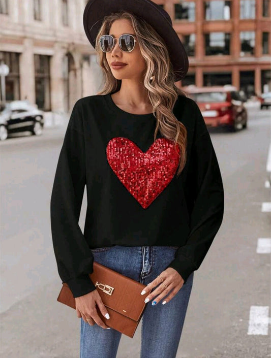 Black sweater with a glowing red heart ❤️✨