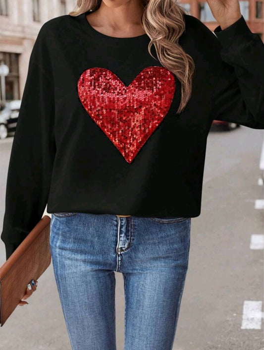 Black sweater with a glowing red heart ❤️✨