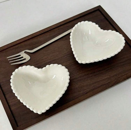 White ceramic heart-shaped dessert or snack plate