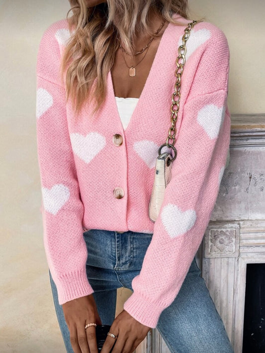 Rožinis moteriškas megztinis su širdelių raštu