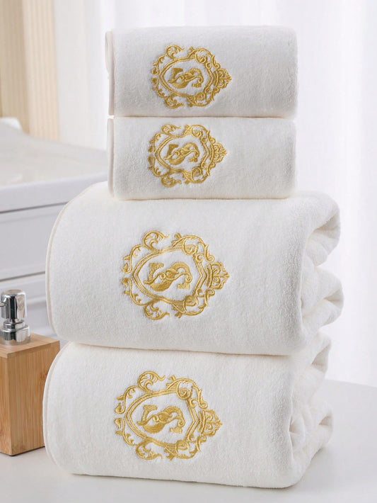 Luxurious towel set with gold monogram embroidery