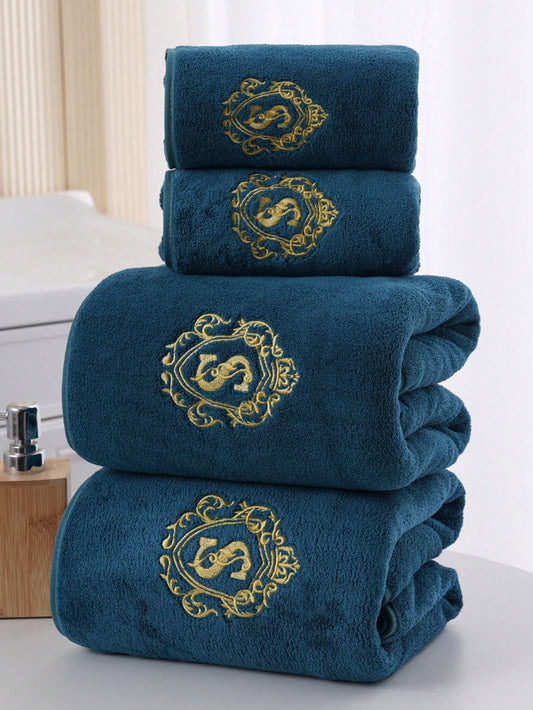 Luxurious towel set with gold monogram embroidery