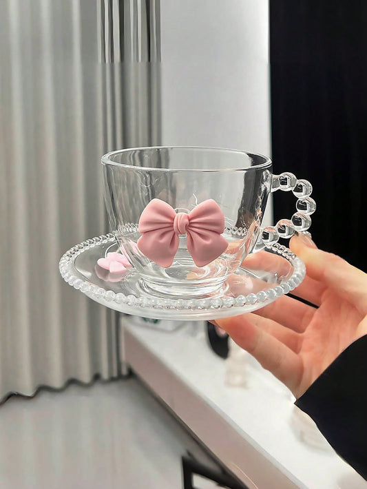 Glass cup with saucer and pink ribbon - elegance for everyday use