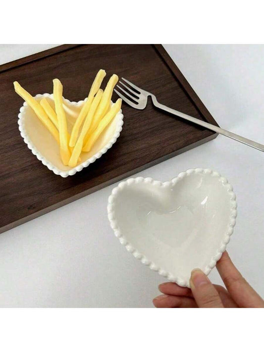 White ceramic heart-shaped dessert or snack plate