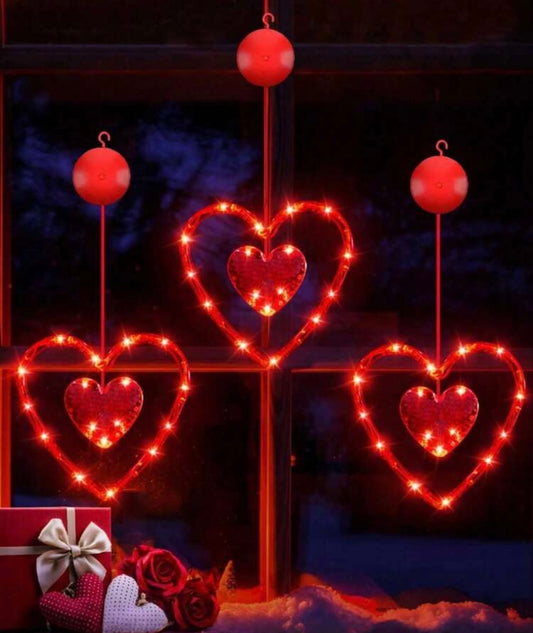 LED šviečiančios širdelės – romantiška lango dekoracija
