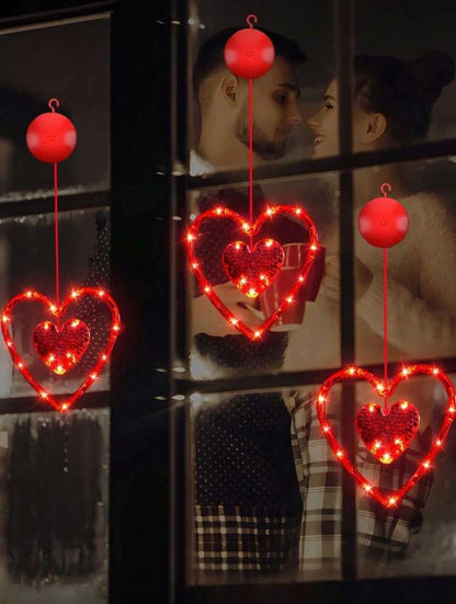 LED šviečiančios širdelės – romantiška lango dekoracija
