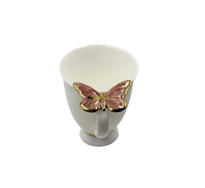 Puodelis su rožiniu drugeliu